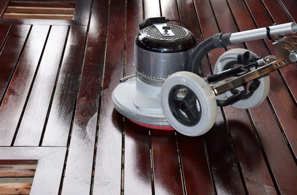 Scrub your low-maintenance wooden deck with a composite cleaner.